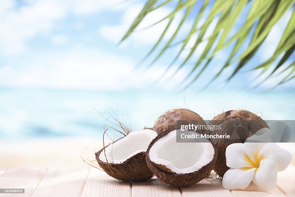 Coconuts on the beach with copy space