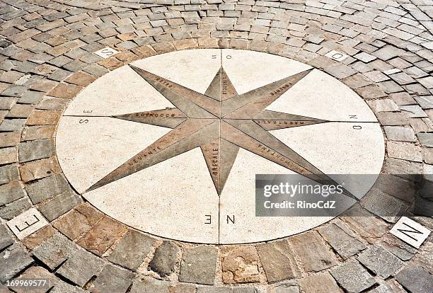 windrose made of cobblestones - compass rose stock pictures, royalty-free photos & images