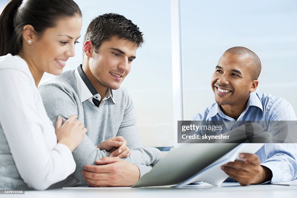 Couple meeting with financial advisor.