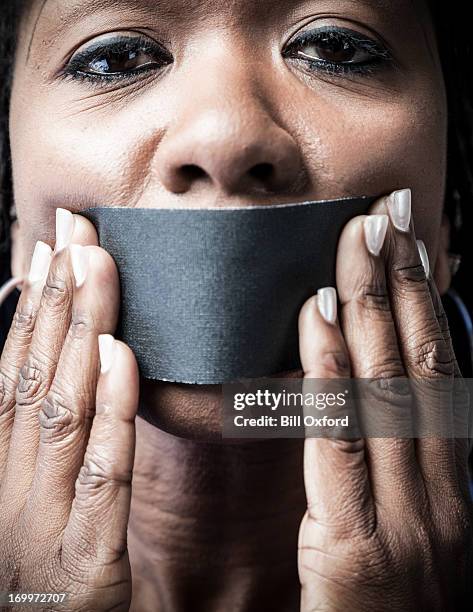 silent minority - word of mouth stock pictures, royalty-free photos & images