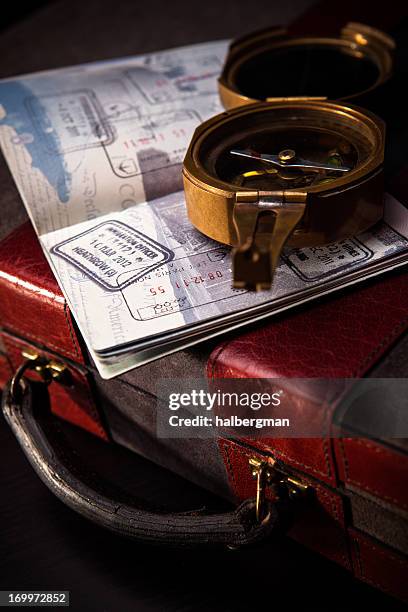 compass, passport, and briefcase - old british passport stock pictures, royalty-free photos & images