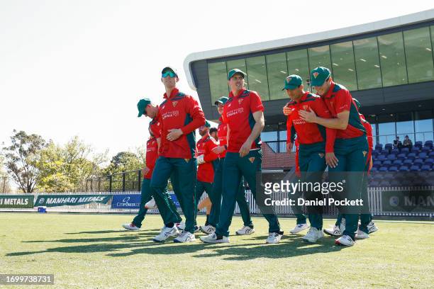 Tasmania run out to field during the Marsh One Day Cup match between Victoria and Tasmania at CitiPower Centre, on September 25 in Melbourne,...