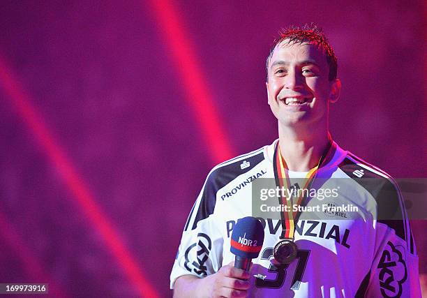 Momir Ilic says goodbye to the fans as the players of THW Kiel present the Bundesliga trophy to the fans at the Sparkasse Arena on June 5, 2013 in...