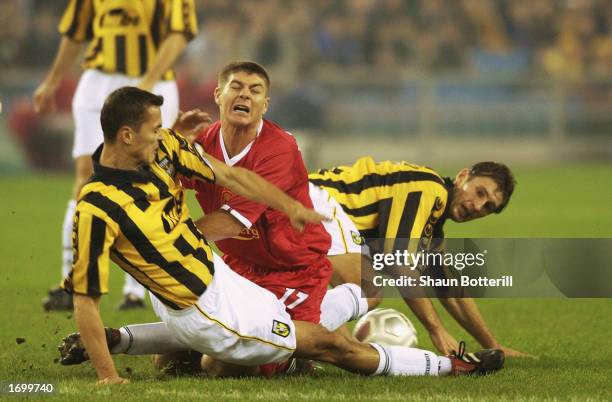 Steven Gerrard of Liverpool is tackled by Marian Zeman and Evgeniy Levchenko of Vitesse Arnhem during the UEFA Cup third round first leg match held...