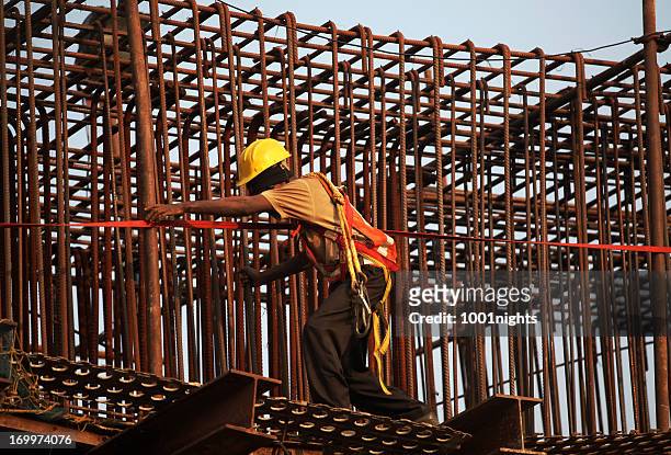 working on a reinforcing bar structure - built structure stock pictures, royalty-free photos & images