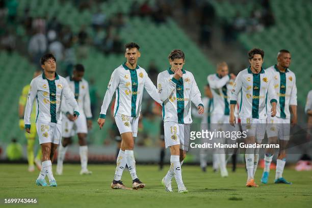 Raul Lopez , Santiago Muñoz and his teammates of Santos lament after loosing the game during the 9th round match between Santos Laguna and Necaxa as...