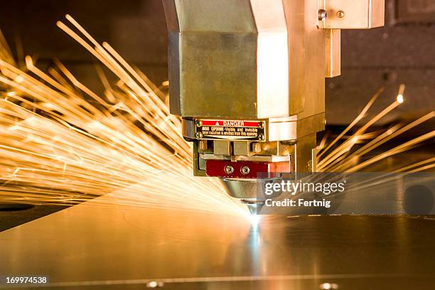 metal, laser-cutting tool. - doorknippen stockfoto's en -beelden