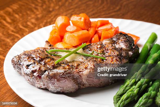 big rib eye steak - strip steak stock pictures, royalty-free photos & images