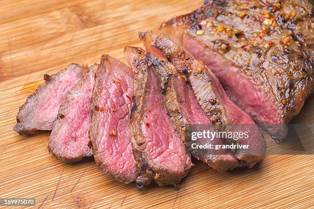 sliced kobe new york steak on a cutting board - beefsteak 2013 stock pictures, royalty-free photos & images