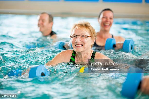 water aerobics - aqua aerobics stock pictures, royalty-free photos & images