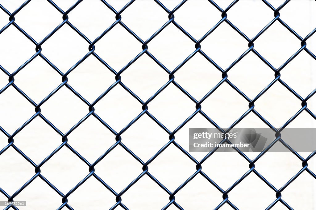 Closeup wire fence aginst white background, copy space