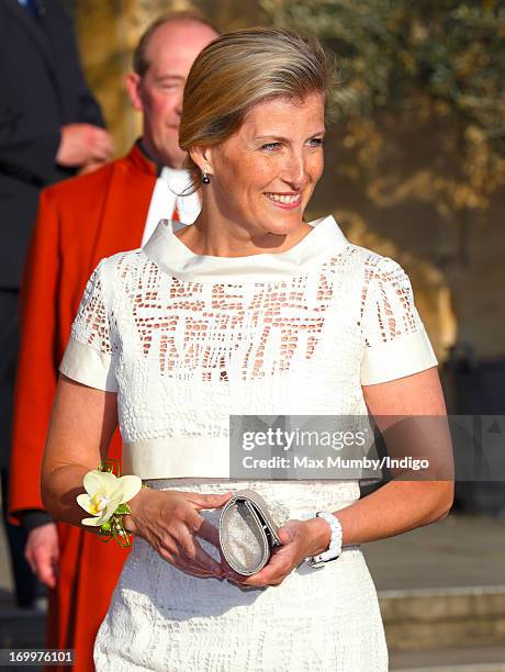 Sophie, Countess of Wessex wears a corsage which she was given whilst attending a reception for the Guildford Flower Festival at Guildford Cathedral...
