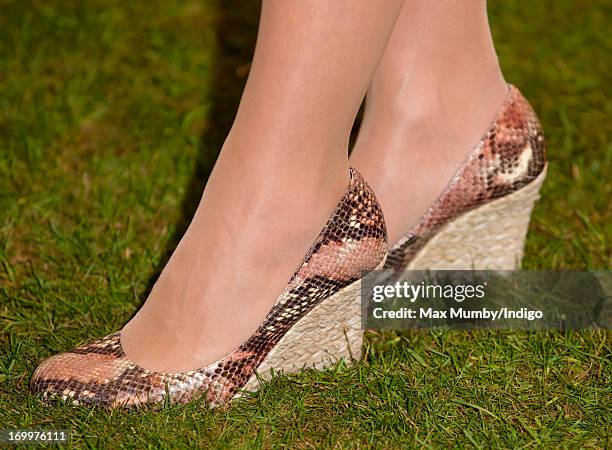 Sophie, Countess of Wessex wears snakeskin style wedge shoes as she attends a reception for the Guildford Flower Festival at Guildford Cathedral...