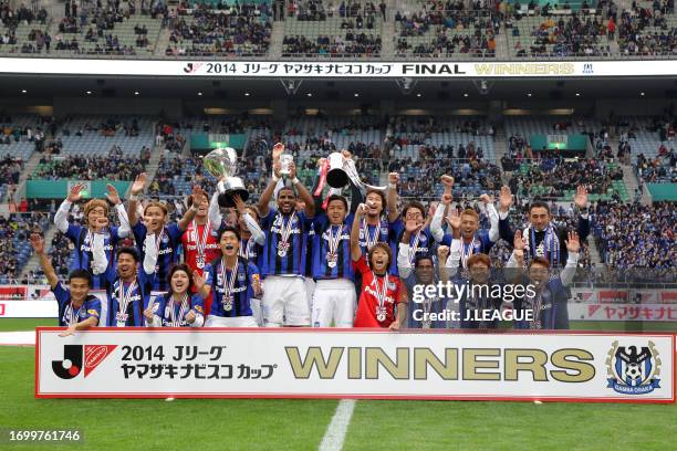 Captain Yasuhito Endo of Gamba Osaka lifts the trophy following the J.League Yamazaki Nabisco Cup final match between Sanfrecce Hiroshima and Gamba...
