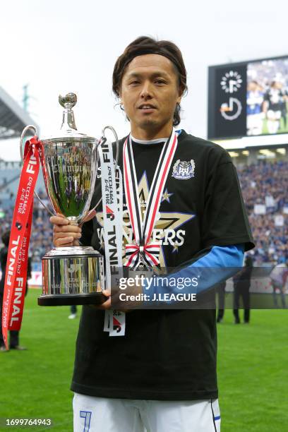 Captain Yasuhito Endo of Gamba Osaka poses with the trophy after his team's 3-2 victory in the J.League Yamazaki Nabisco Cup final match between...