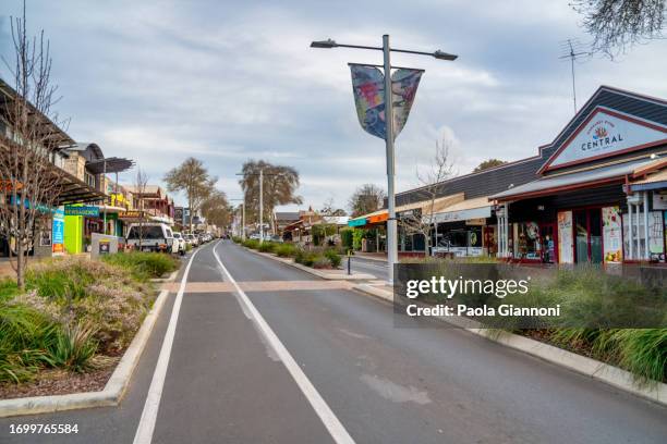 city streets and buildings at sunset - town stock pictures, royalty-free photos & images