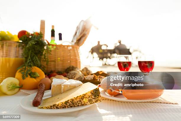 picnic on jetty closeup - wine basket stock pictures, royalty-free photos & images