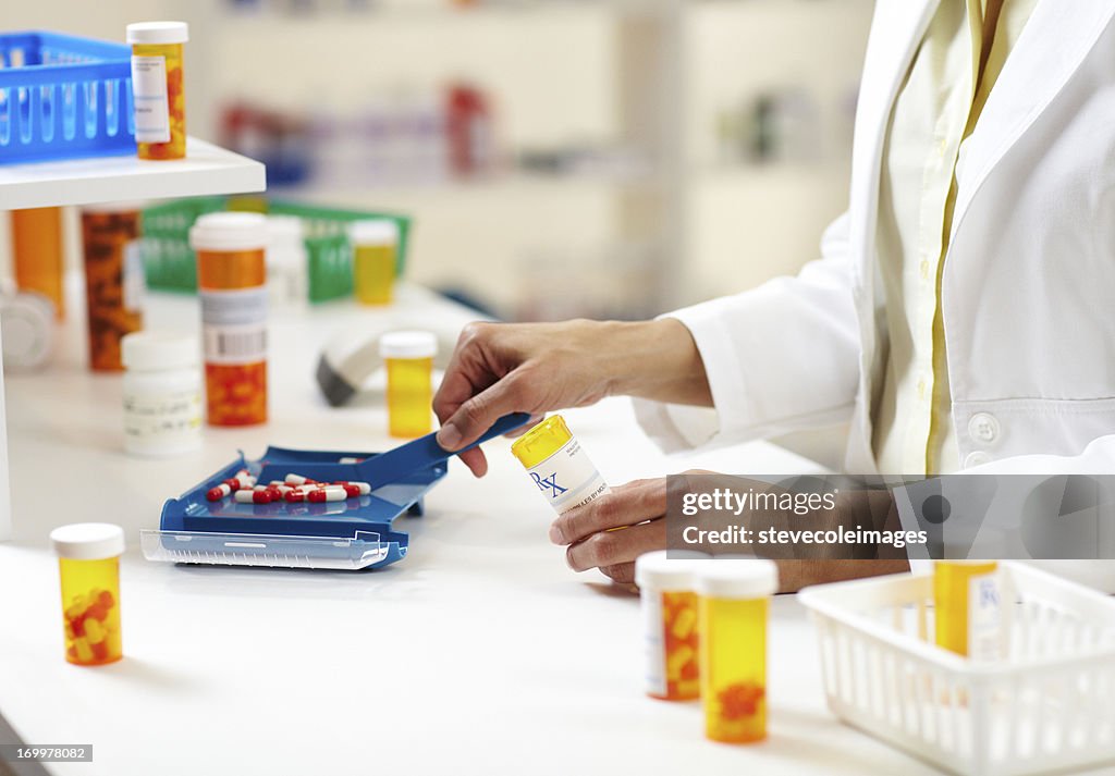 Pharmacist Filling Prescription of Pills