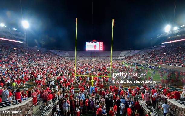 Mississippi Rebels fans rush the field after a college football game between the LSU Tigers and Mississippi Rebels on Saturday, September 30, 2023 at...