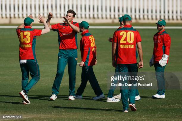 Mitchell Owen of Tasmania celebrates the dismissal of Thomas Rogers of Victoria during the Marsh One Day Cup match between Victoria and Tasmania at...