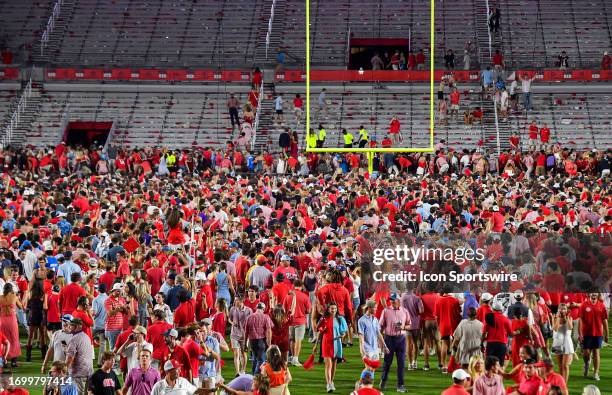 Mississippi Rebels fans rush the field after a college football game between the LSU Tigers and Mississippi Rebels on Saturday, September 30, 2023 at...
