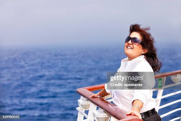 happy relaxed woman enjoying on a cruise ship main deck - cruise deck stock pictures, royalty-free photos & images