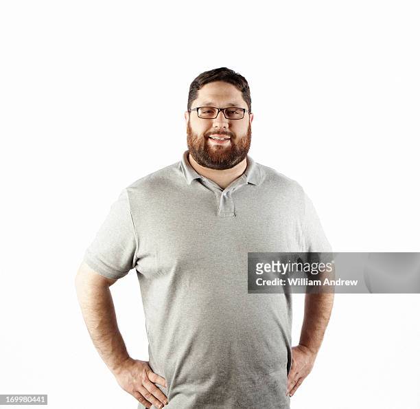 portrait of a man with hands on hips - mid adult men stock pictures, royalty-free photos & images