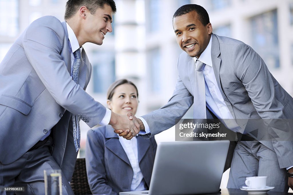 Business people shaking hands.