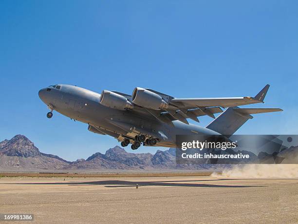 c17 globemaster iii taking off - aircraft taking off stock pictures, royalty-free photos & images