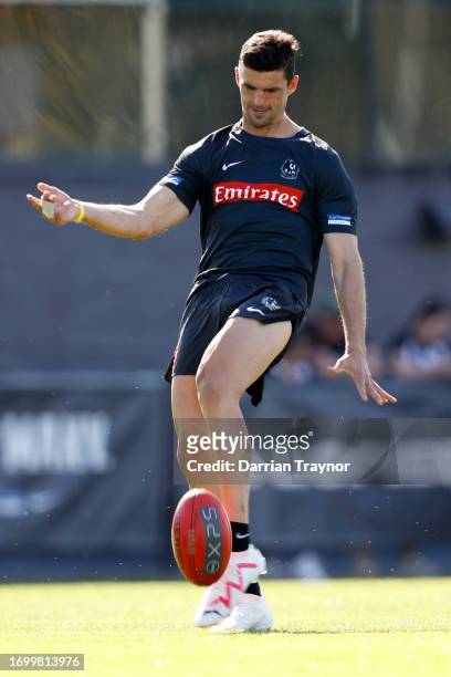 Scott Pendlebury of the Magpies kicks the ball during a Collingwood Magpies AFL training session at AIA Centre on September 25, 2023 in Melbourne,...