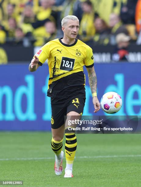 Marco Reus of Borussia Dortmund plays the ball during the Bundesliga match between Borussia Dortmund and VfL Wolfsburg at Signal Iduna Park on...