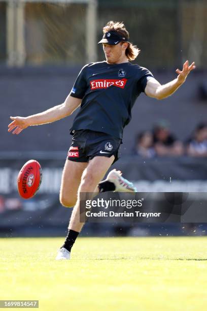 Nathan Murphy of the Magpies kicks the ball during a Collingwood Magpies AFL training session at AIA Centre on September 25, 2023 in Melbourne,...