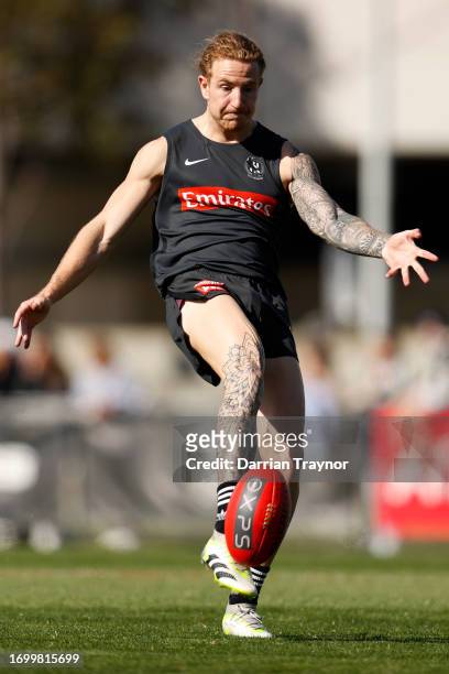 Beau McCreery of the Magpies kicks the ball during a Collingwood Magpies AFL training session at AIA Centre on September 25, 2023 in Melbourne,...
