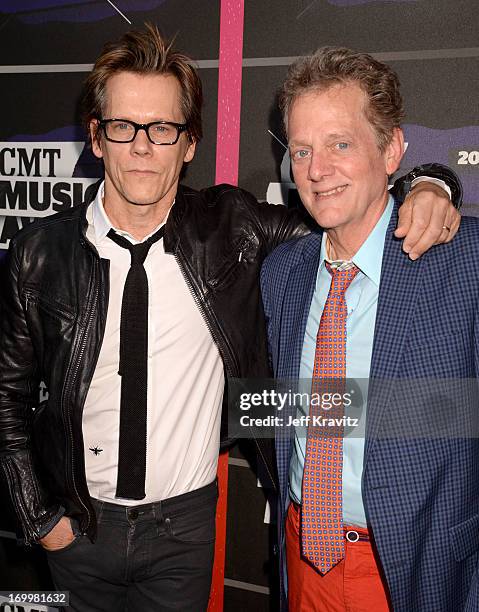 Kevin Bacon and Michael Bacon of the band The Bacon Brothers arrive at the 2013 CMT Music Awards at the Bridgestone Arena on June 5, 2013 in...