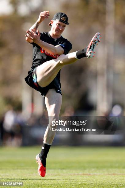 John Noble of the Magpies kicks the ball during a Collingwood Magpies AFL training session at AIA Centre on September 25, 2023 in Melbourne,...