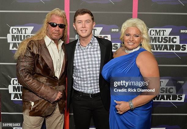 Duane Dog Lee Chapman, Scotty McCreery, and Beth Chapman attends the 2013 CMT Music awards at the Bridgestone Arena on June 5, 2013 in Nashville,...