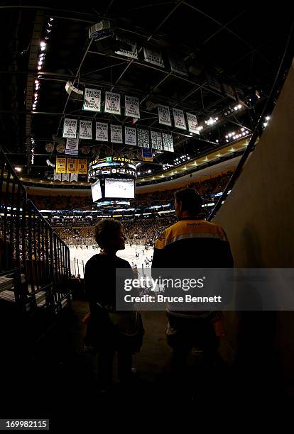 Fans prepare to walk to their seats prior to Game Three of the Eastern Conference Final of the 2013 NHL Stanley Cup Playoffs between the Boston...