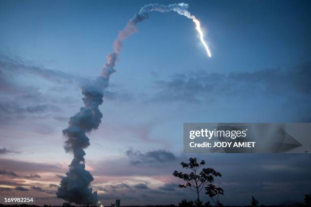 The Ariane 5 blasts off from the ground at the French Guiana European Spaceport of Kourou on June 5, 2013. A European rocket blasted off from French...