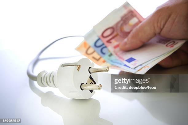 energy saving - euro in hand bildbanksfoton och bilder