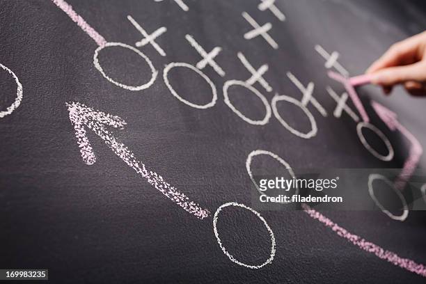 hand drawing a game strategy - american football sport stock pictures, royalty-free photos & images