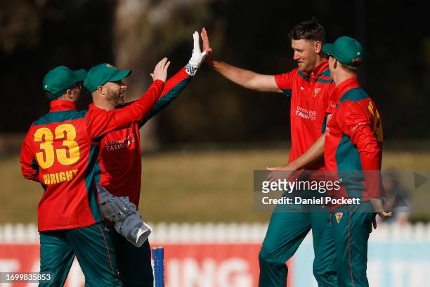 Beau Webster of Tasmania celebrates the dismissal of Peter Handscomb of Victoria during the Marsh One Day Cup match between Victoria and Tasmania at...
