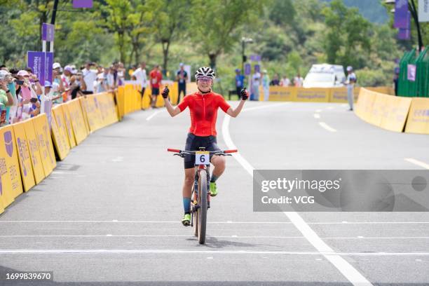 Li Hongfeng of Team China competes in the Cycling Mountain Bike - Women's Cross Country Olympic on day two of the 19th Asian Games at Chun'an Jieshou...