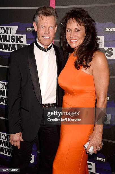Singer Randy Travis and Mary Beougher arrive at the 2013 CMT Music Awards at the Bridgestone Arena on June 5, 2013 in Nashville, Tennessee.