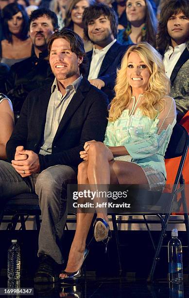 Singer Carrie Underwood and husband Mike Fisher attend the 2013 CMT Music Awards at the Bridgestone Arena on June 5, 2013 in Nashville, Tennessee.