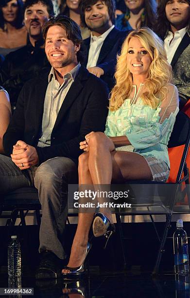 Singer Carrie Underwood and husband Mike Fisher attend the 2013 CMT Music Awards at the Bridgestone Arena on June 5, 2013 in Nashville, Tennessee.