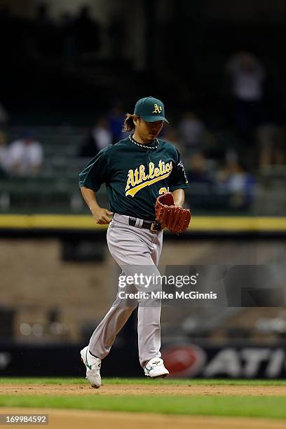 Hideki Okajima of the Oakland Athletics pitches in the bottom of the eighth inning against the Milwaukee Brewers during the interleague game at...