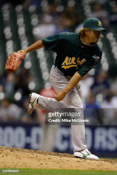 Hideki Okajima of the Oakland Athletics pitches in the bottom of the eighth inning against the Milwaukee Brewers during the interleague game at...