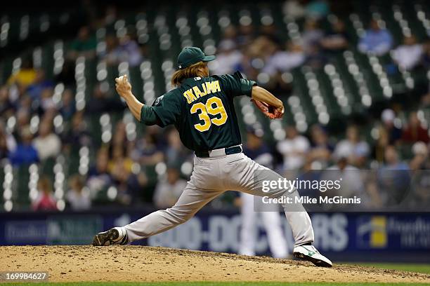 Hideki Okajima of the Oakland Athletics pitches in the bottom of the eighth inning against the Milwaukee Brewers during the interleague game at...