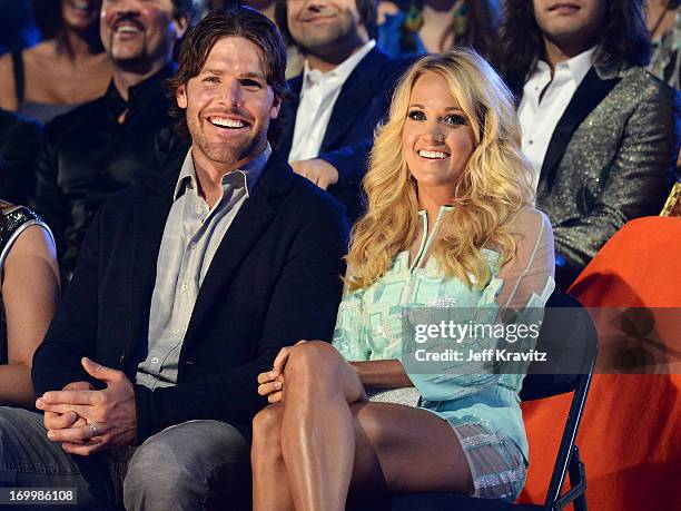 Singer Carrie Underwood and husband Mike Fisher attend the 2013 CMT Music Awards at the Bridgestone Arena on June 5, 2013 in Nashville, Tennessee.