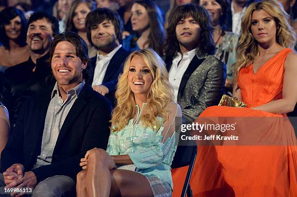 Singer Carrie Underwood and husband Mike Fisher attend the 2013 CMT Music Awards at the Bridgestone Arena on June 5, 2013 in Nashville, Tennessee.